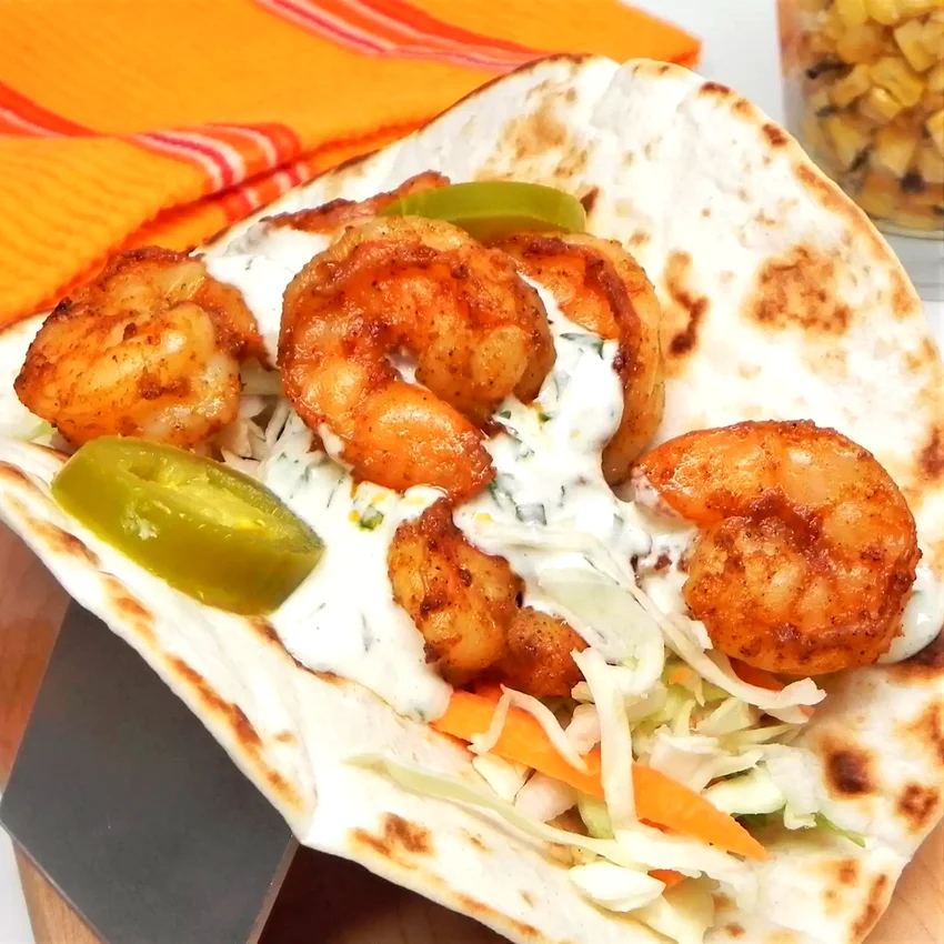 15 Delicious Air Fryer Shrimp Dishes Made in Under 60 Minutes Air Fryer Shrimp Tacos with Creamy Cilantro Sauce