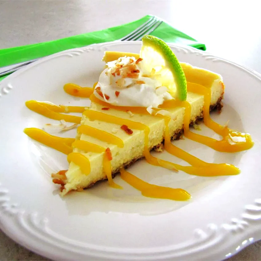 30 Zesty Lime Treats Bursting with Fresh Citrus Taste Coconut-Lime Cheesecake with Mango Coulis