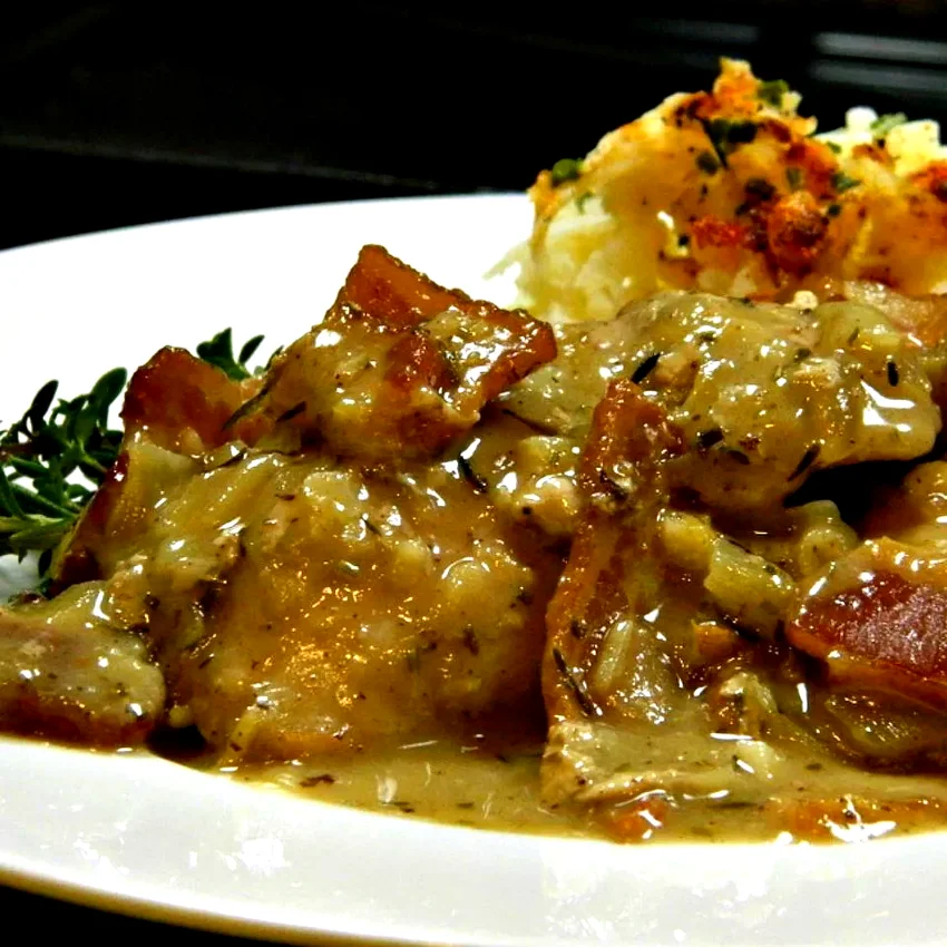10 Coq au Vin Dishes That Will Make You Feel Elegant Coq Au Vin with Rosemary and Thyme