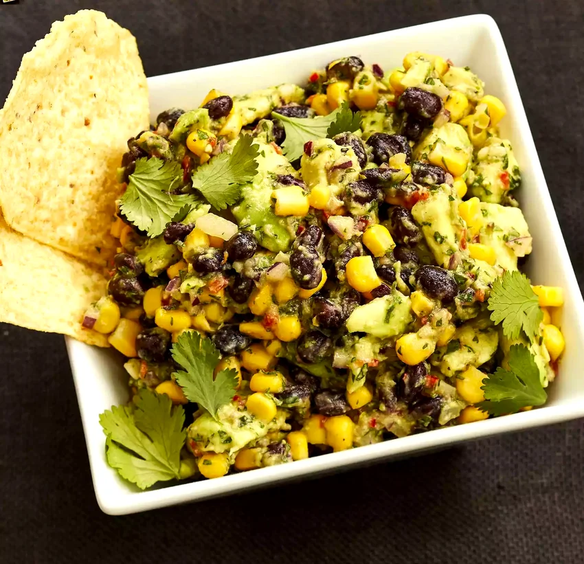 41 Champion Recipes For Your Game Day Taco Station Corn and Black Bean Guacamole