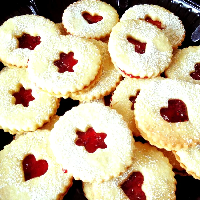 25 Elegant Christmas Cookie Recipes Perfect for Gifting Cranberry Cornmeal Linzer Cookies