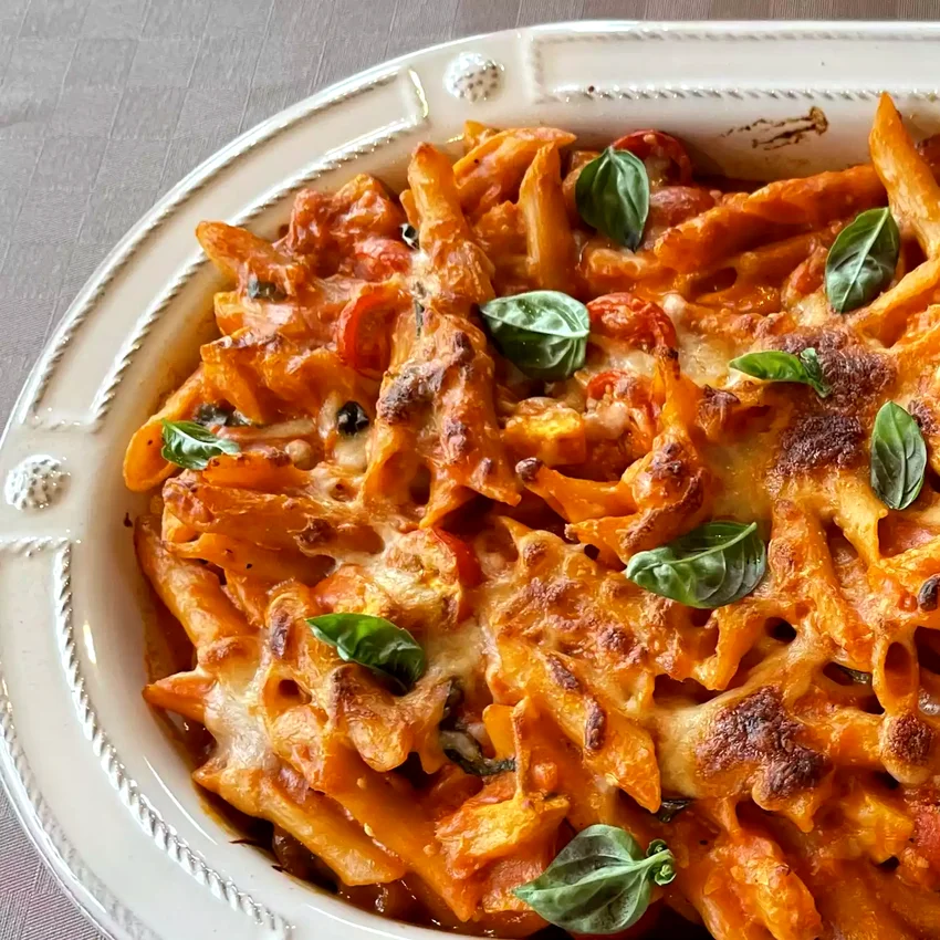 33 Comfort Pasta Dishes Loaded with Melted Cheese Creamy Pasta Bake with Cherry Tomatoes and Basil