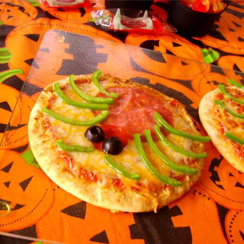 24 Spooky Halloween Dinner & Party Ideas That Will Wow Creepy Mini Pizzas