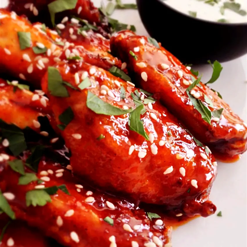 27 Flavorful Sweet and Spicy Chicken Dishes for Bold Tastes Crispy Honey Sriracha Chicken Wings