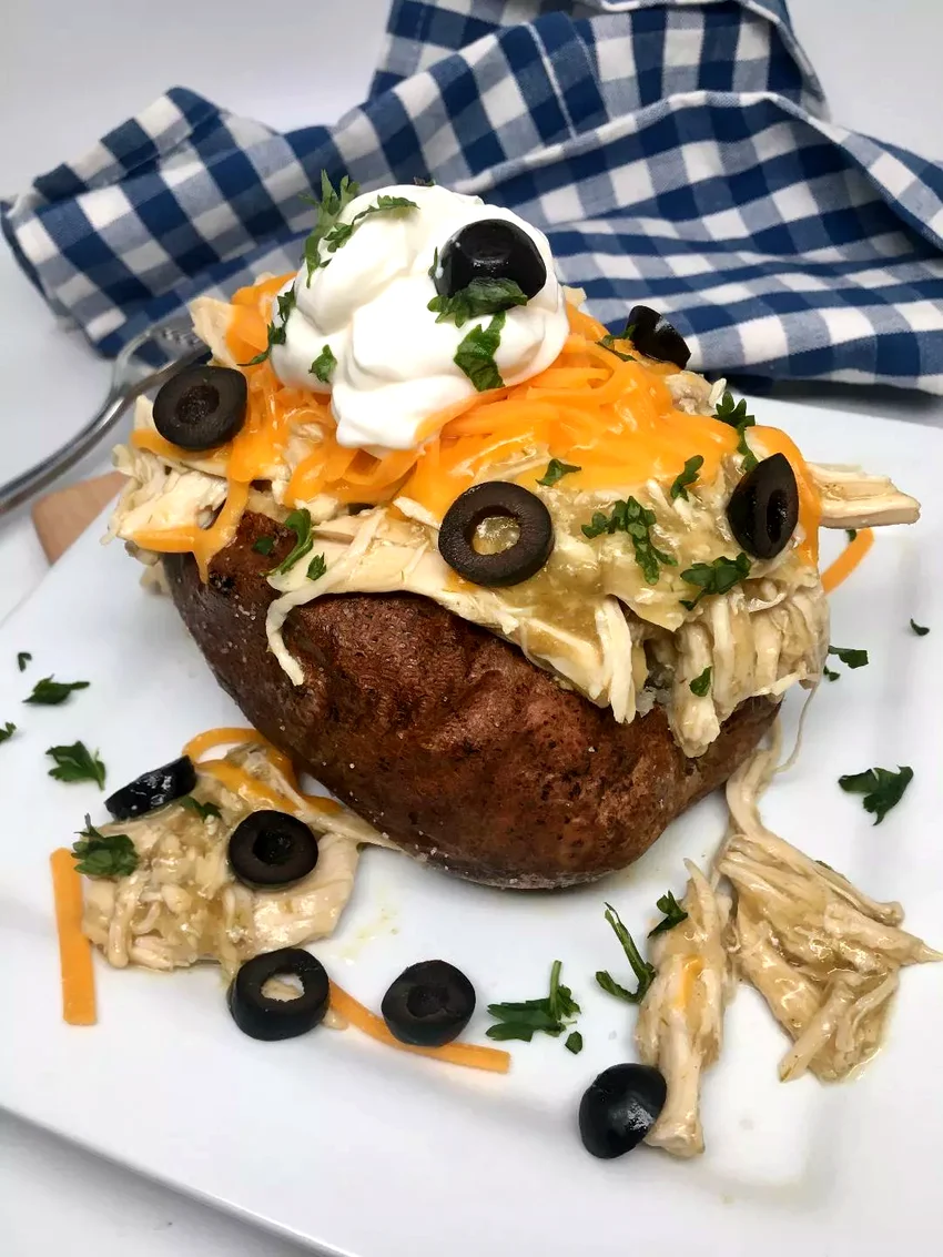 24 Chicken & Potato Dishes That Never Get Old Green Chicken Enchilada-Stuffed Baked Potato