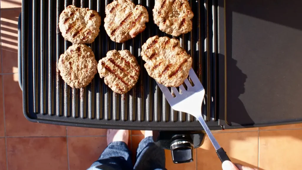 Grilling, Specifically for Flipping and Draining Liquids Through the Slots