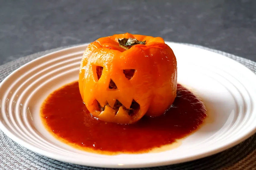 24 Spooky Halloween Dinner & Party Ideas That Will Wow Jack-O-Lantern Stuffed Peppers