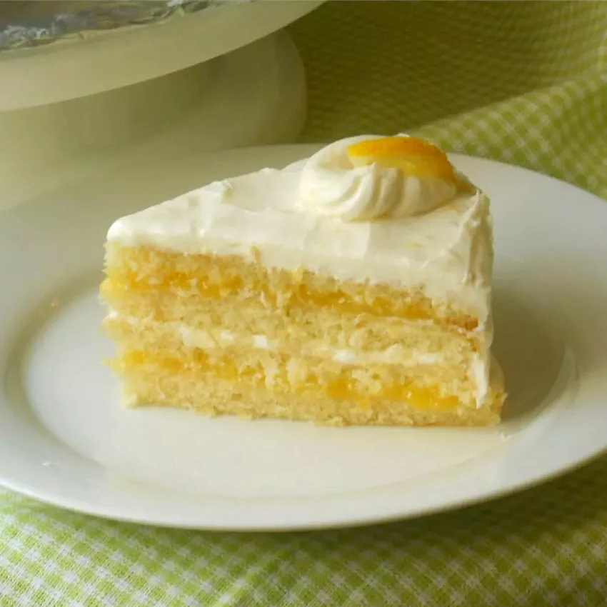 21 Amazing Lemon Sweet Treats to Brighten Your Day Lemon Cake with Lemon Filling and Lemon Butter Frosting