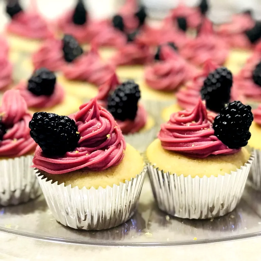 21 Amazing Lemon Sweet Treats to Brighten Your Day Lemon Cupcake with Blackberry Buttercream