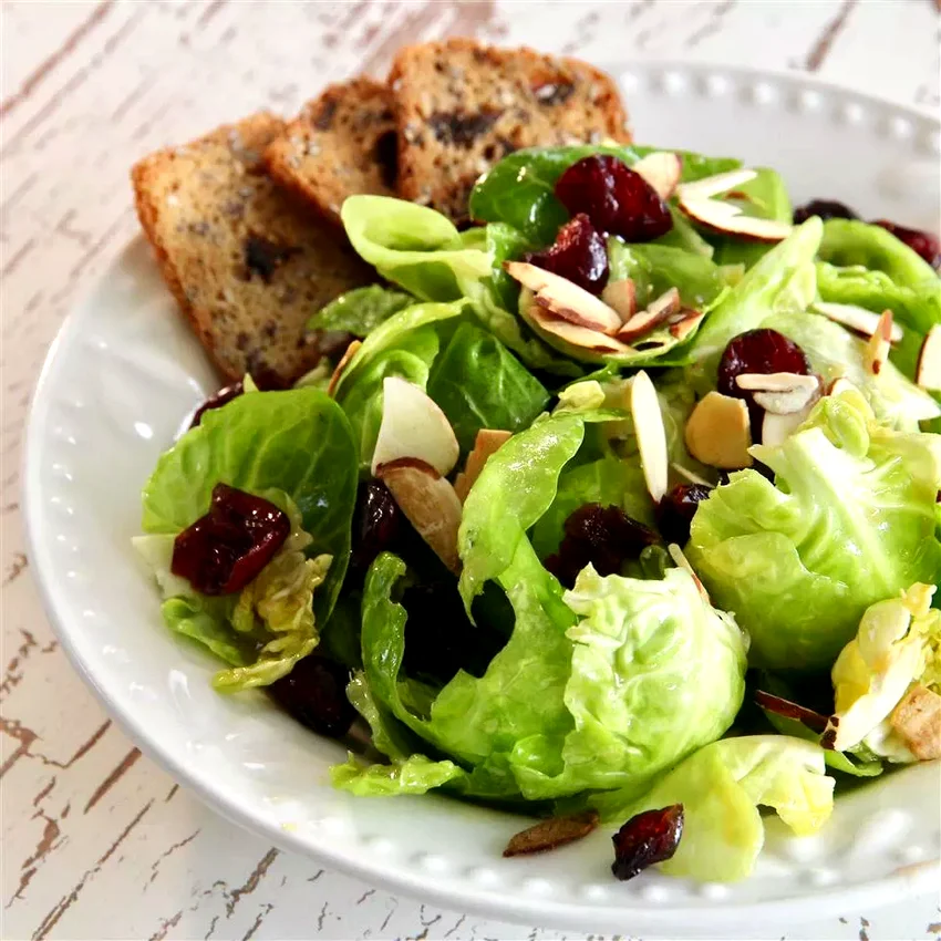 25 Dried Cranberry Dishes You'll Love Every Season Maple-Dijon Brussels Leaf Salad