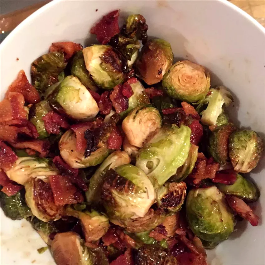 30 Simple Christmas Side Dishes That Won't Stress You Out Maple Roasted Brussels Sprouts with Bacon