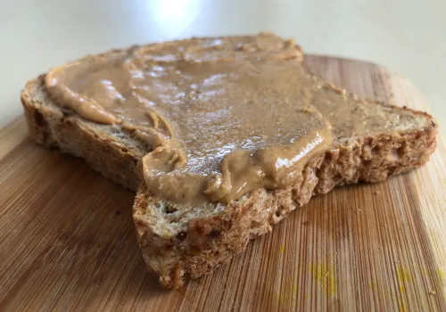 Peanut butter on whole grain bread