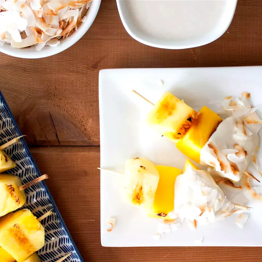 16 Fire-Grilled Pineapple Recipes That Bring Summer Magic Pineapple and Mango Skewers with Coconut Dip