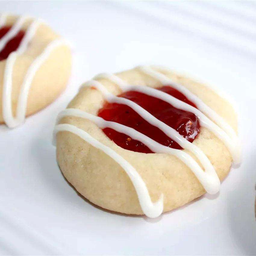 25 Elegant Christmas Cookie Recipes Perfect for Gifting Raspberry and Almond Shortbread Thumbprints
