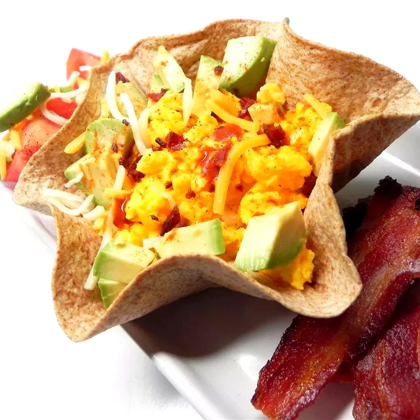 Top 50 Egg Breakfast Ideas to Simplify Your Mornings Scrambled Eggs, Cheese, and Avocado Tortilla Bowl