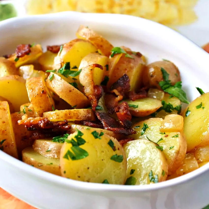 35 Creative Yukon Gold Potato Recipe Ideas Sliced Potatoes with Bacon and Parsley