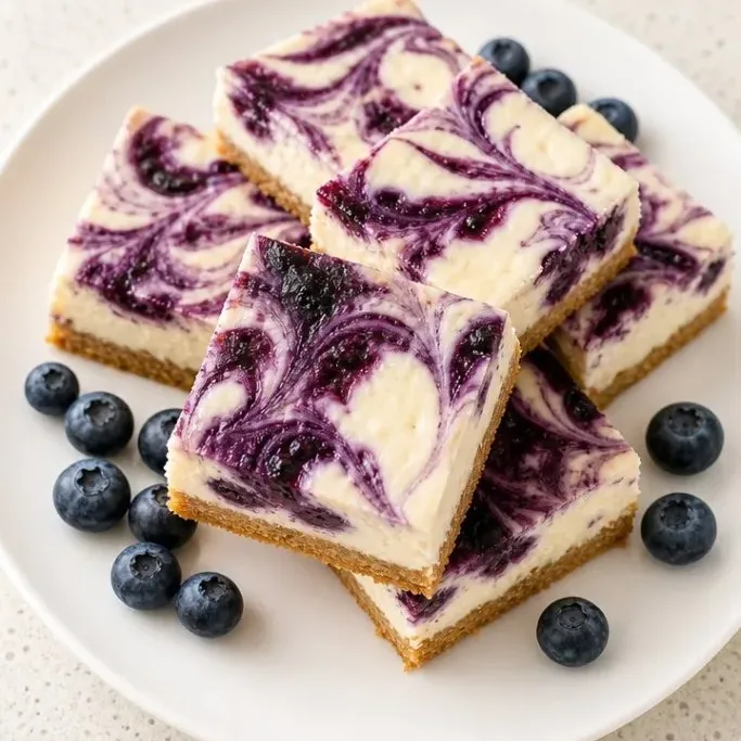 Creamy Blueberry Cheesecake Bars with a Buttery Crust Blueberry Cheesecake Bars