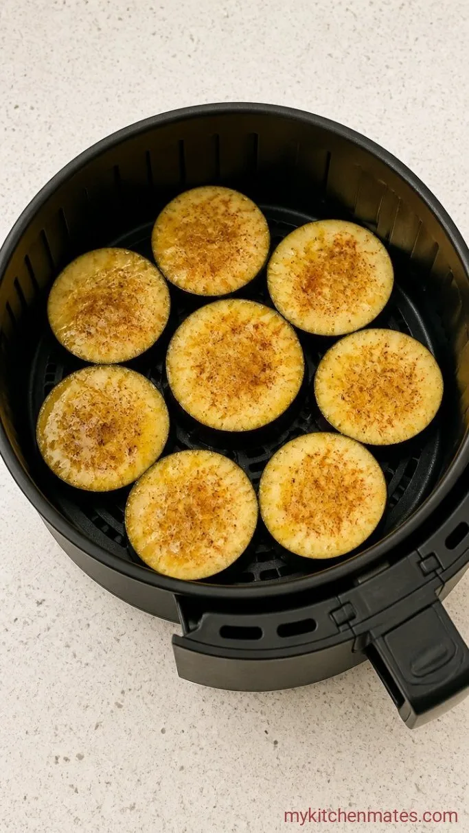 Crispy Air Fryer Eggplant in 15 Minutes Step 1: Slice and Season the Eggplant