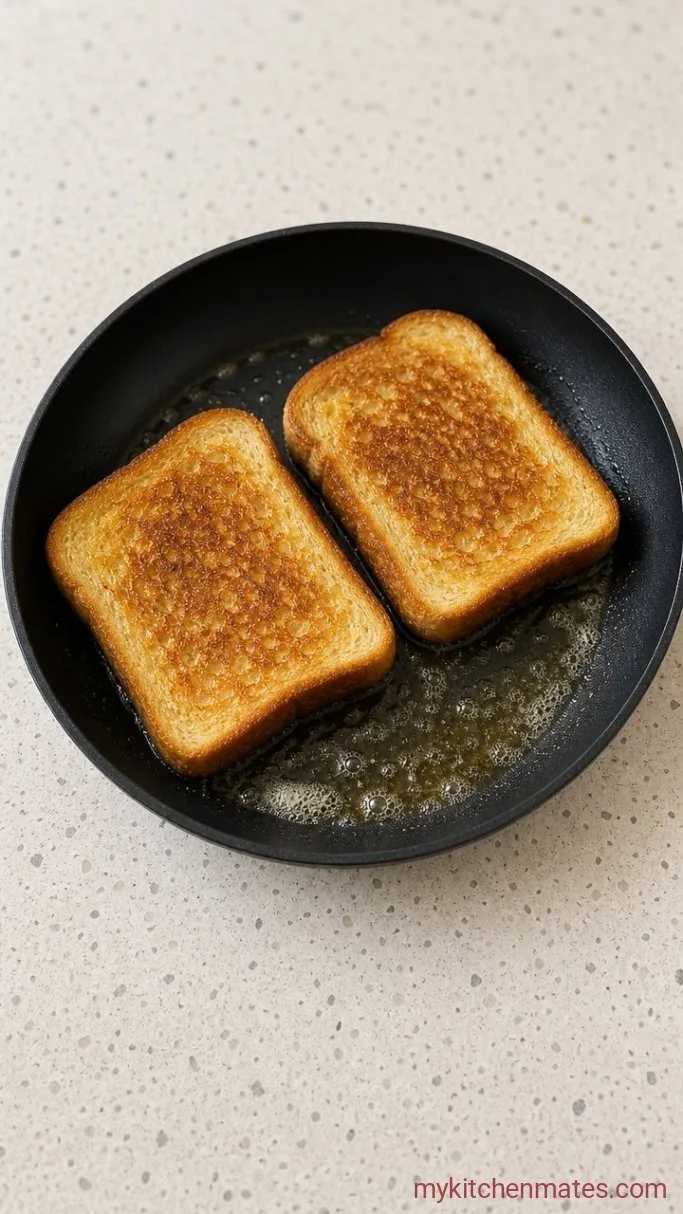 Fried Egg Sandwich with a Runny Yolk and Toasty Bread Step 1: Toast the Bread in Butter