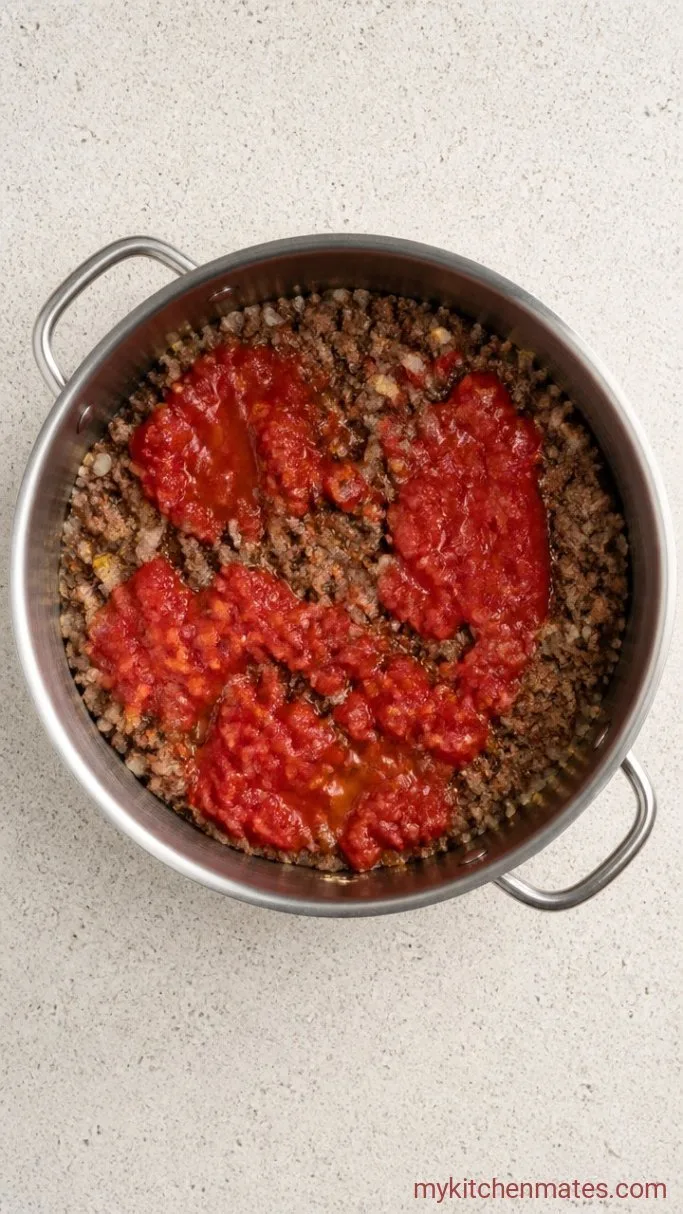 Step 2: Add the Aromatics and Tomatoes