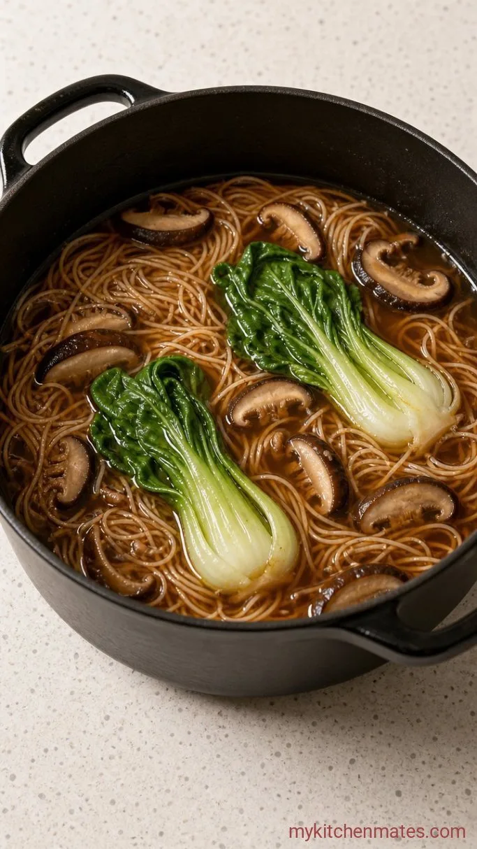 20-Minute Asian Chicken Soup with Ginger and Soy Step 3: Stir in the Noodles and Greens