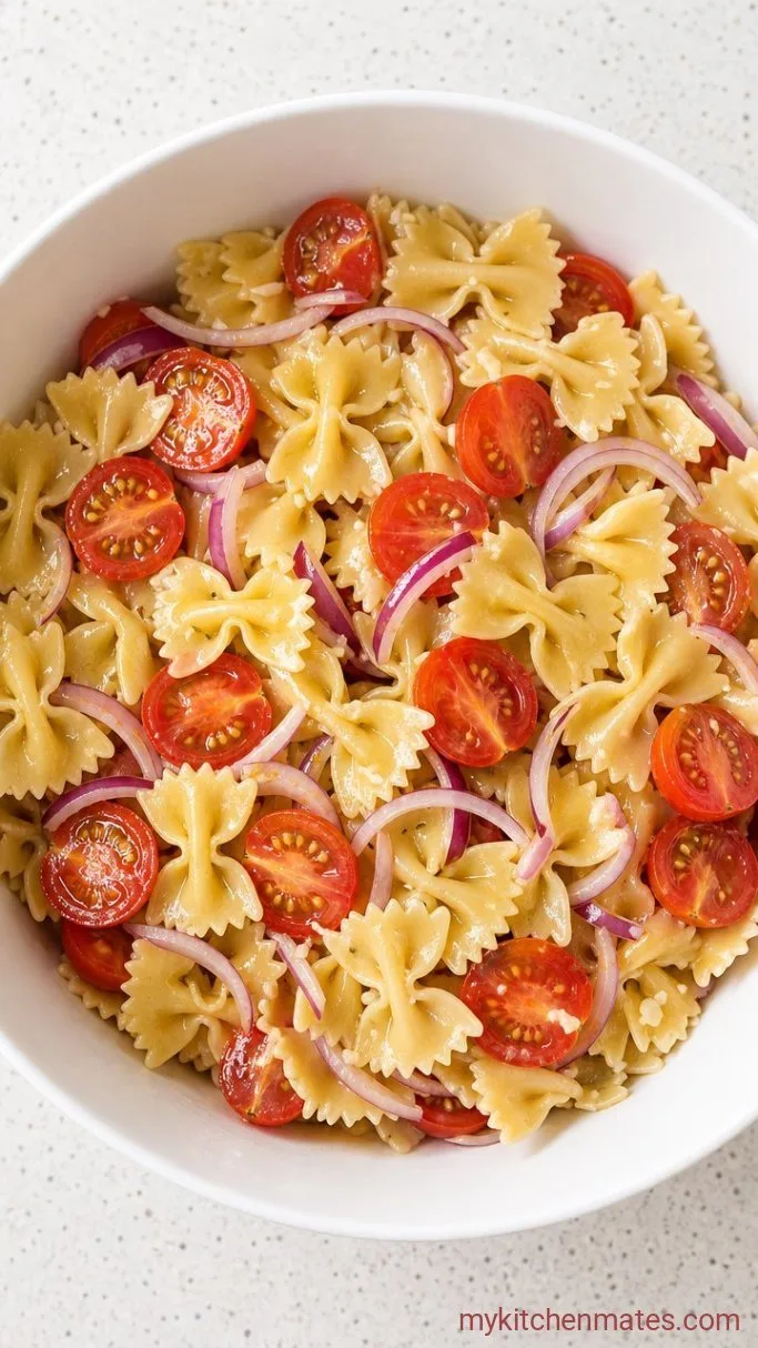 Bright & Easy Spinach Pasta Salad with Cherry Tomatoes and Feta Step 3: Toss the Dressing with Pasta and Veggies