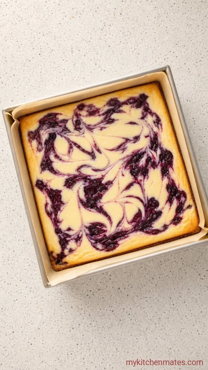 Creamy Blueberry Cheesecake Bars with a Buttery Crust Step 5: Bake the Cheesecake Bars